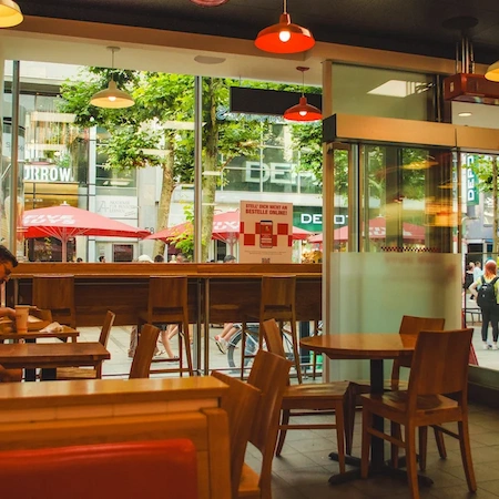 The inside of a Five Guys restaurant with red accents